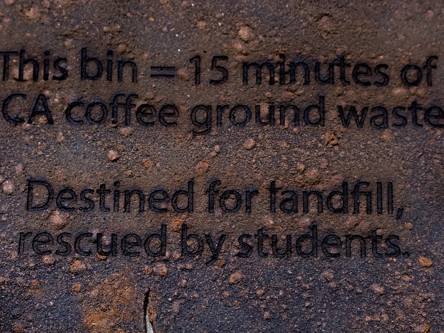 Text reads: this bin = 15 minutes of RCA coffee ground waste. Destined for landfill, rescued by students