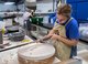 Serena Dicks carving a mold on the whirler